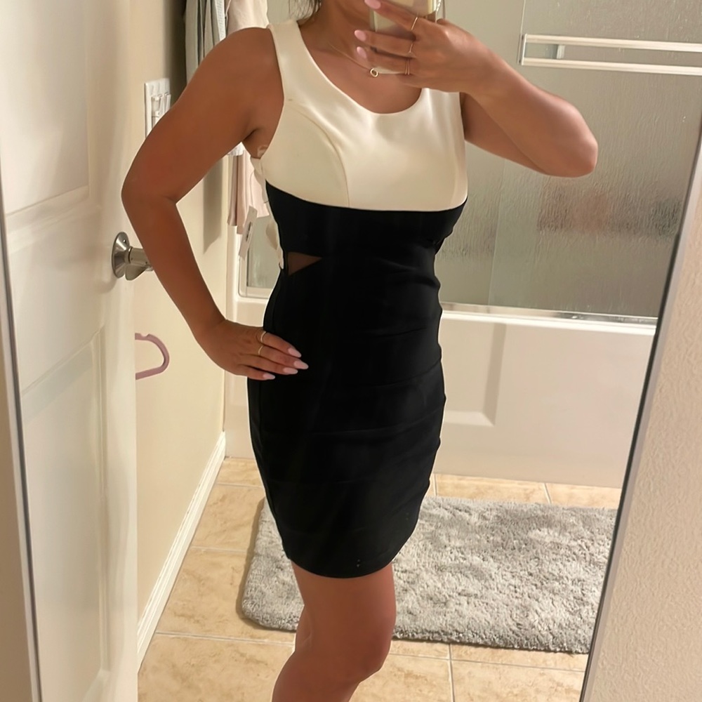 Black and white mini dress with mesh cutouts side triangle crisscross back